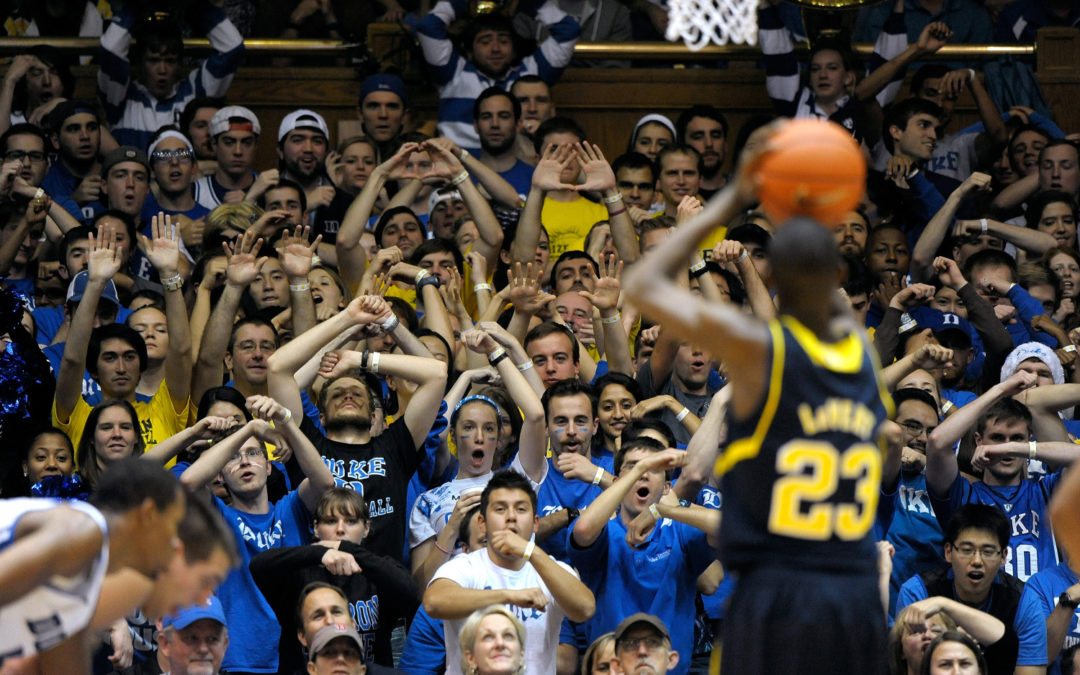 Popular ethics speaker Corey Ciocchetti on being happy and doing the easy stuff in life correctly to prepare to do the harder stuff. This is a photo of a crowd distracting a free throw shooter by Grant Halverson/Getty Images